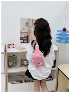 Rear view of a pink unicorn print kids chest bag with adjustable shoulder strap