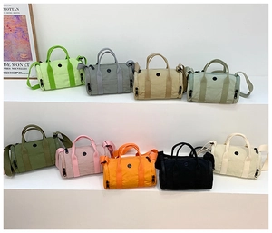 Collection of colorful mini cylinder bags for kids in various shades with adjustable straps