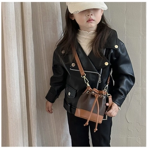 Detail of children's mini bucket bag with leopard print accent and gold hardware