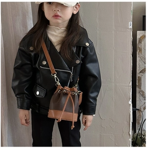 Kid's biker jacket paired with a brown textured leather drawstring bucket bag