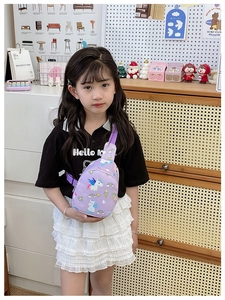 Detail of purple cartoon unicorn crossbody bag for kids with adjustable nylon strap