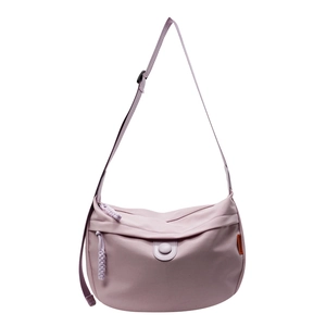 Light purple minimalist canvas dumpling bag with adjustable shoulder strap and orange label