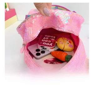 Detail view of pink sequin kids backpack showing spacious interior and smooth lining