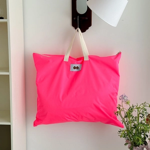 Neon pink large capacity shoulder bag for kids featuring cartoon chestnut logo and zip closure