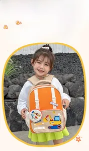 Outdoor scene of a child wearing the cute orange excavator backpack with side pouch