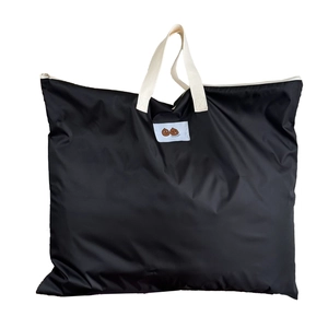 Black large capacity nylon tote bag for kids with white handles and cartoon label