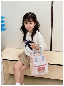 Close-up of heart sequins and pink cat ears on this stylish toddler backpack for girls