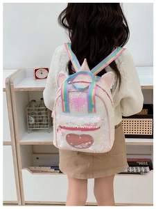 Detail view of colorful rainbow straps and iridescent sequins on the unicorn toddler backpack