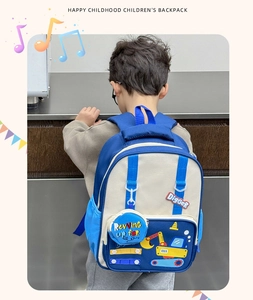 Rear view of a child wearing the navy blue cartoon excavator backpack with side pouch