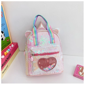 Detail of pink sequin unicorn backpack with rainbow handle and glitter heart pocket