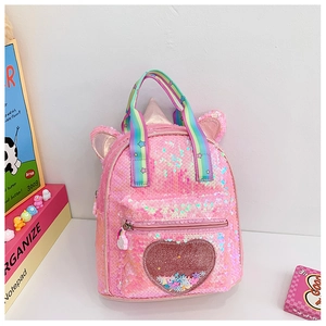 Detail of sequin unicorn backpack showing a glittery heart pocket with liquid sand