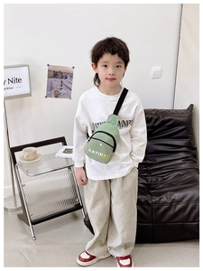 Close-up of lightweight green crossbody bag for boys with vibrant letter print