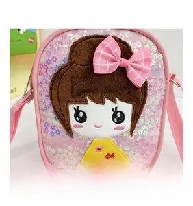 Detail of pink sequin girl's crossbody bag with cartoon embroidery and 3D bow