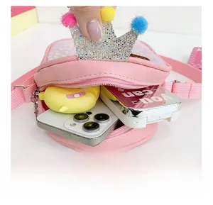 Detail showing the inner capacity of the pink sequin crown crossbody bag for kids