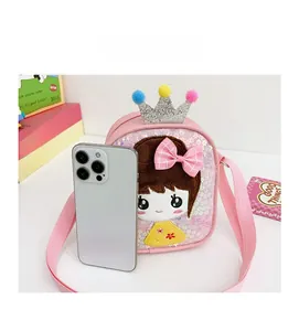 Detailed size comparison of pink sequin girl crossbody bag with a smartphone