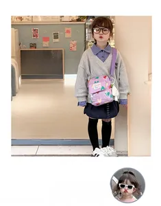 Purple kids crossbody bag with heart patterns, transparent PVC pocket and plush pendant