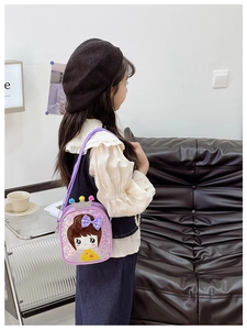 Detail of purple sequin kids crossbody bag featuring crown and cute cartoon girl design