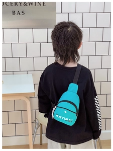 Rear view of a child wearing a stylish blue nylon chest bag with white KAYINAI lettering