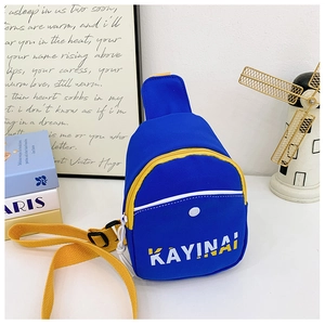 Close-up of blue nylon crossbody bag with yellow zipper and white KAYINAI lettering detail