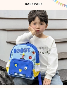 Close-up of cute blue robot backpack featuring 3D facial details and side mesh pocket