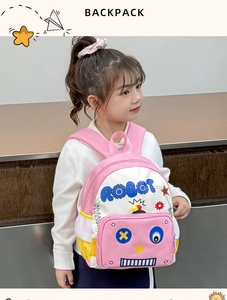 Pink and white robot backpack with mesh side pocket shown on a young girl model