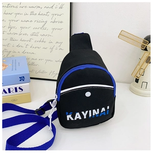 Detail of black canvas kids chest bag with blue strap and Kayinai letter printing