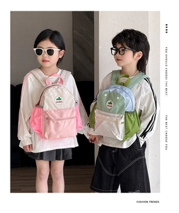 Detailed view of kids color-block backpacks with mesh side pockets and zipper front bags