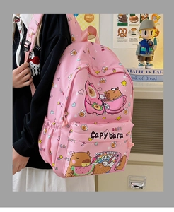 Detailed side view of pink Capybara cartoon backpack with water-resistant fabric and pockets
