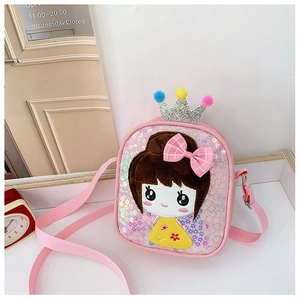 Close-up of pink sequin kids crossbody bag featuring a cartoon girl and crown