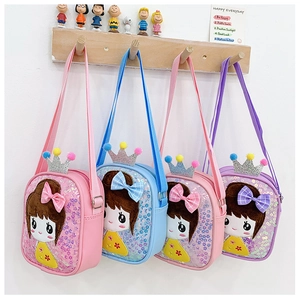 Detail of sequined kids crossbody bags with cartoon patches and glittery crowns
