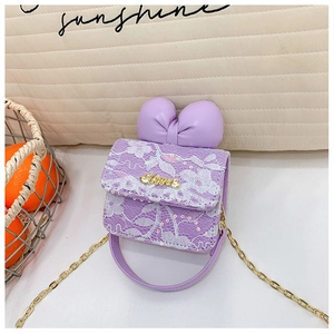 Close-up of purple lace mini bag featuring a large bow and golden Love nameplate