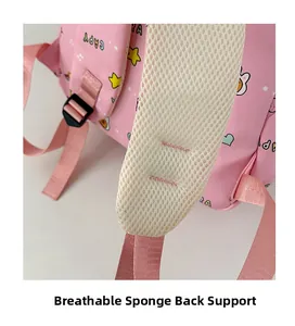 Detail of pink cartoon backpack featuring breathable mesh sponge padding on shoulder straps