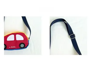 Detail showing red cartoon car bag with adjustable navy nylon strap and metal buckle