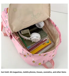Detailed interior of a pink cartoon backpack showing large capacity and storage space