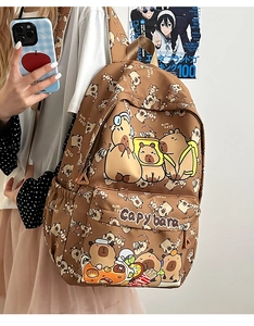 Brown backpack with Capybara print shown on a model for casual daily student use
