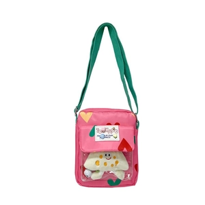 Pink heart-patterned kids crossbody bag with white plush doll in front pocket