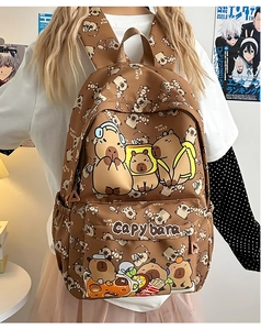 Detail of cute brown capybara print backpack with large embroidery and side pocket