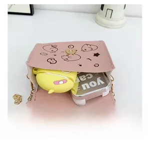Internal capacity view of pink cartoon shoulder bag with gold chain strap for kids