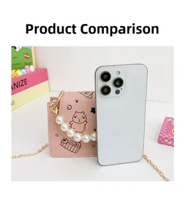 Size comparison of a pink Kapibara small shoulder bag with pearls and a smartphone