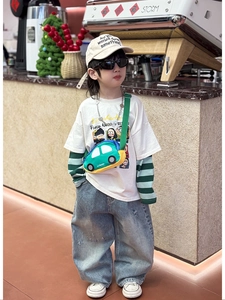 Kid in casual outfit featuring a cute green car-shaped crossbody chest bag for boys