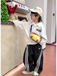 Kids outfit featuring a grey sweatshirt and yellow cartoon car shape crossbody bag