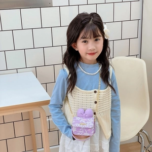 Mini lavender lace crossbody bag for girls featuring a 3D bow and gold chain strap