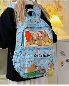 Detail of light blue backpack featuring cute capybara cartoon prints and a front pocket