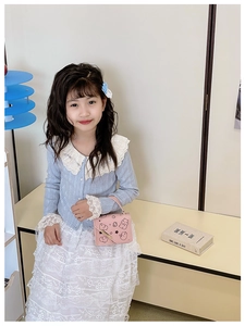 Pink cartoon handbag for girls featuring cute bear prints and a chic metal buckle clasp