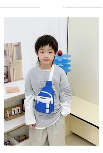 Detail view of durable blue nylon fabric and white adjustable strap on children's chest bag