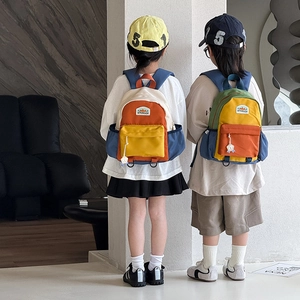 Kids color-block backpack with wide straps and front pocket for school or travel