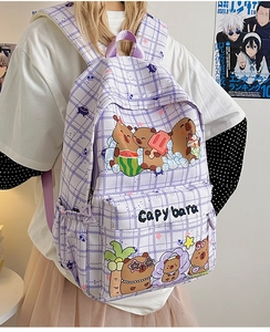 Close-up of cute cartoon Capybara print on a purple plaid school backpack for girls
