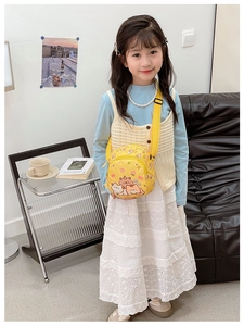 Detail of yellow round crossbody bag with cute bear and cat prints for children