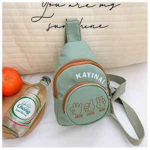 Detail of light green canvas chest bag with orange zipper and playful hand gestures print