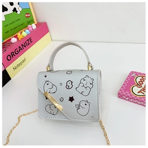 Detail of silver cartoon hamster mini bag with gold chain strap and metal trim